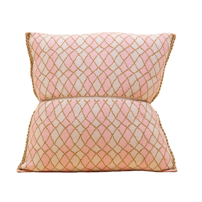 front side of pink bow-shaped knit pillowcase with romb pattern in viscose
