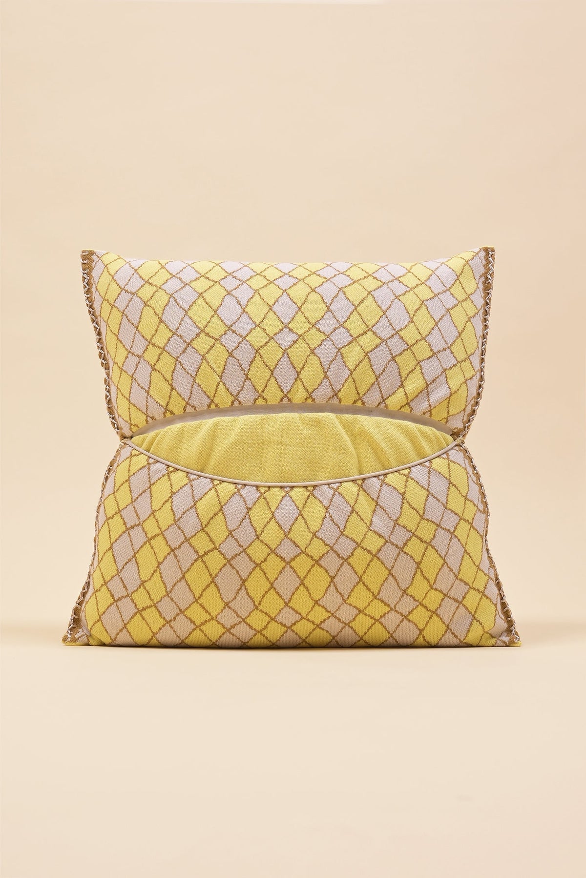 back side of yellow bow-shaped knit pillowcase with romb pattern in viscose
