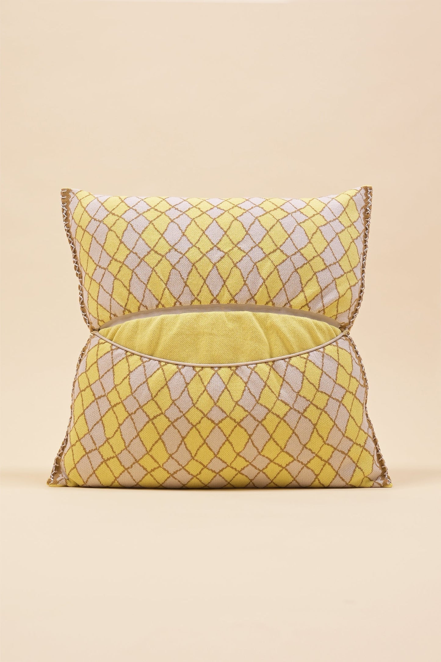 back side of yellow bow-shaped knit pillowcase with romb pattern in viscose
