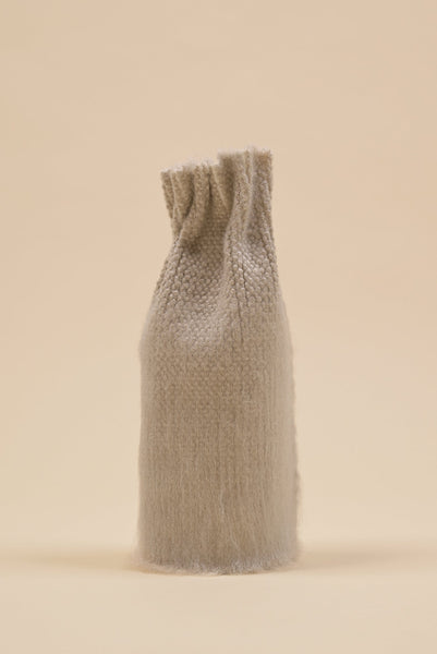 front view of beige knit textile vase in brushed silk and organic cotton with beige background