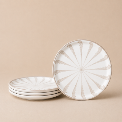 Set of ceramic plates with decorative patterns on a beige background