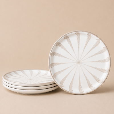 Set of ceramic plates with decorative pattern on a beige background