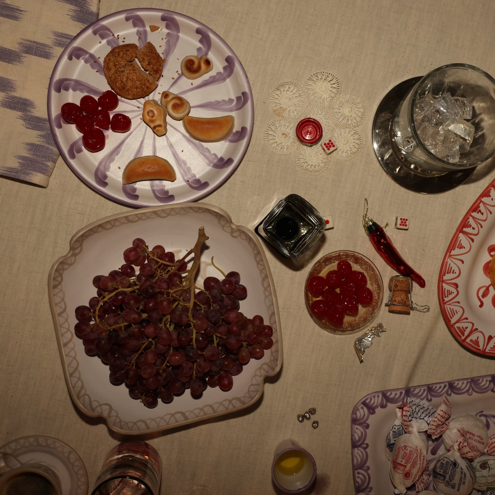 Decorative plates with fruit and a pitcher on a tablecloth  - lifestyle