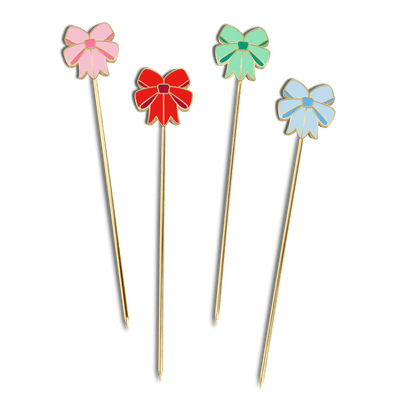 Octaevo’s Coquette Cocktail Picks (Set of 4) feature gold bows in pink, red, green, and blue on a plain background.