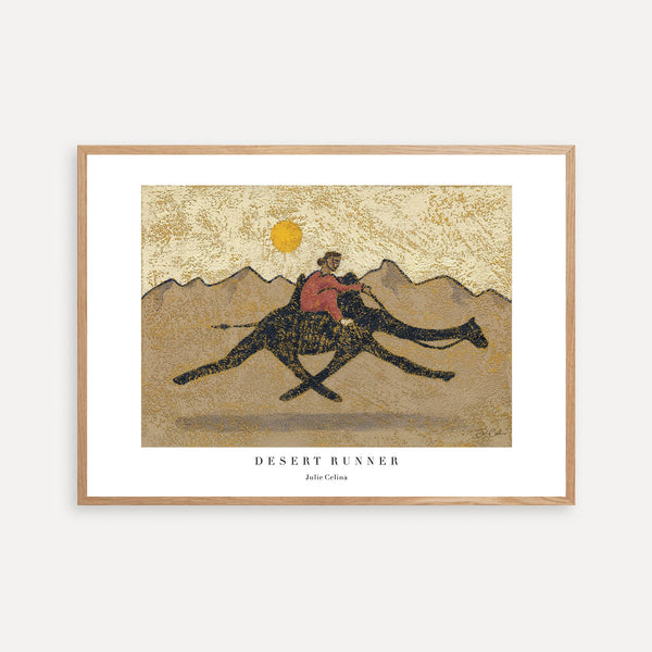 a print of a person riding a camel in the desert