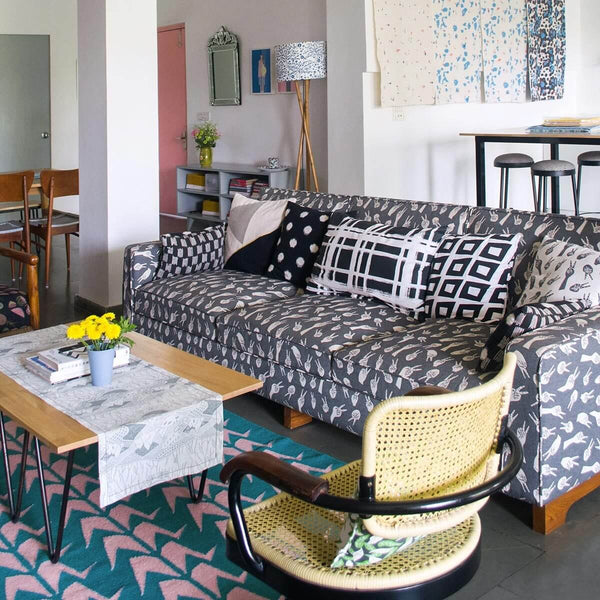 Living room with green and pink flatweave wool rug