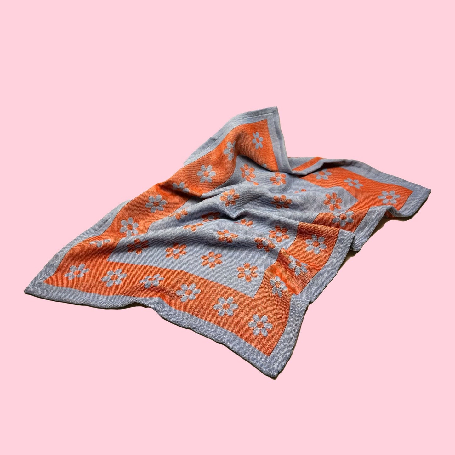 blue and red cotton dish towel / tea towel with graphic emoji flower pattern, made in portugal, designed in sweden