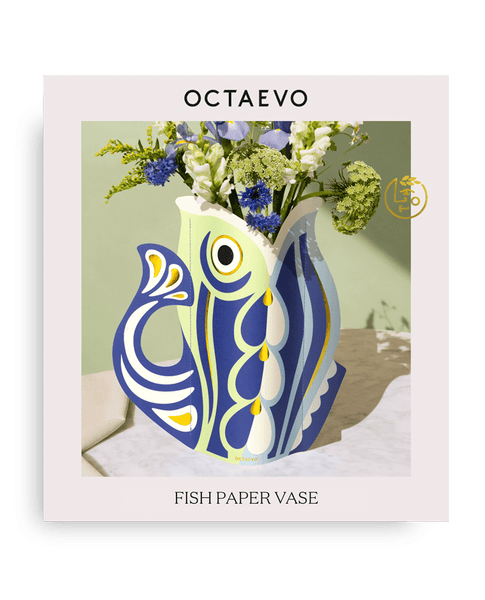 Blue Fish-shaped paper vase with floral arrangement on an OCTAEVO packaging. 