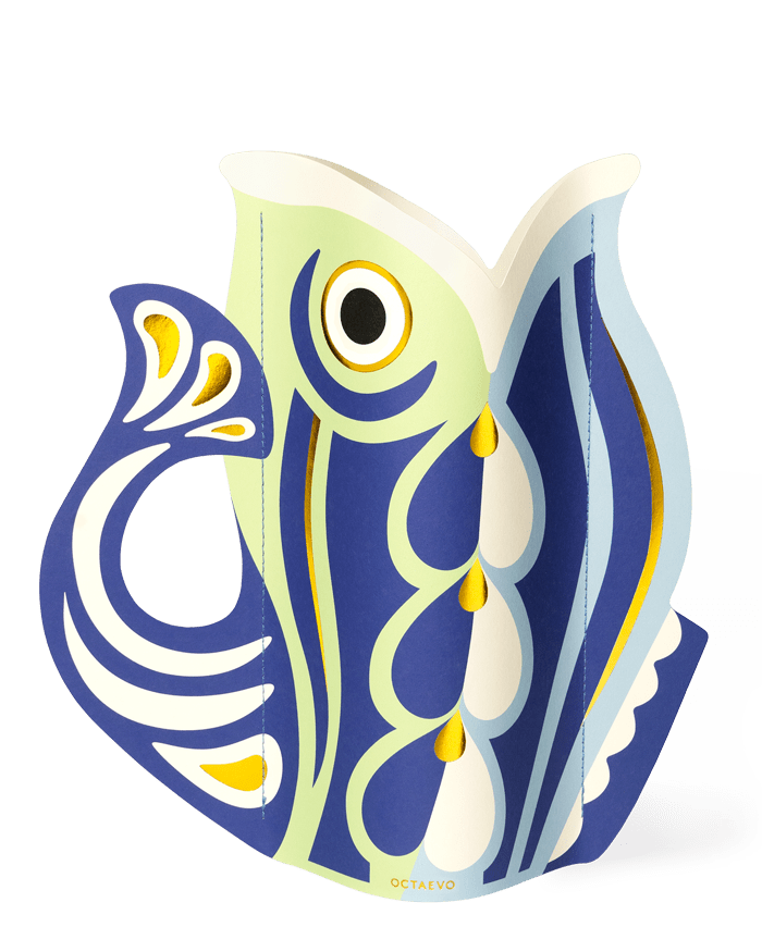 The OCTAEVO Fish Paper Vase features bold Mediterranean-inspired abstract patterns in a stylized fish shape.