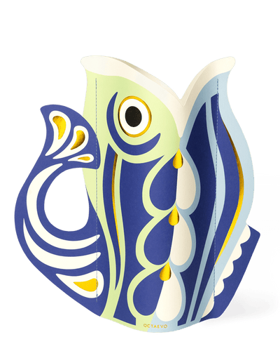 The blue OCTAEVO Fish Paper Vase features bold Mediterranean-inspired abstract patterns in a stylized fish shape.