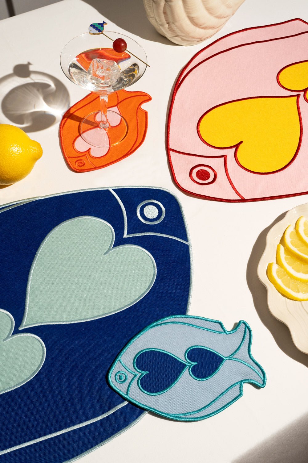 Add a splash of color with Octaevos Fish Splash Coasters (Set of 4), perfect for tables with fruit and drinks.