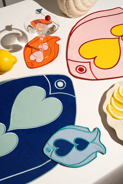 Add a splash of color with Octaevos Fish Splash Coasters (Set of 4), perfect for tables with fruit and drinks.