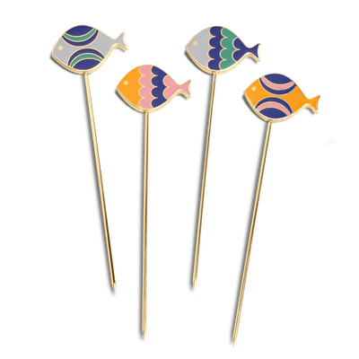 Octaevo’s Fish Splash Cocktail Picks (Set of 4) feature gold plating and fish tops in blue, pink, purple, and orange.