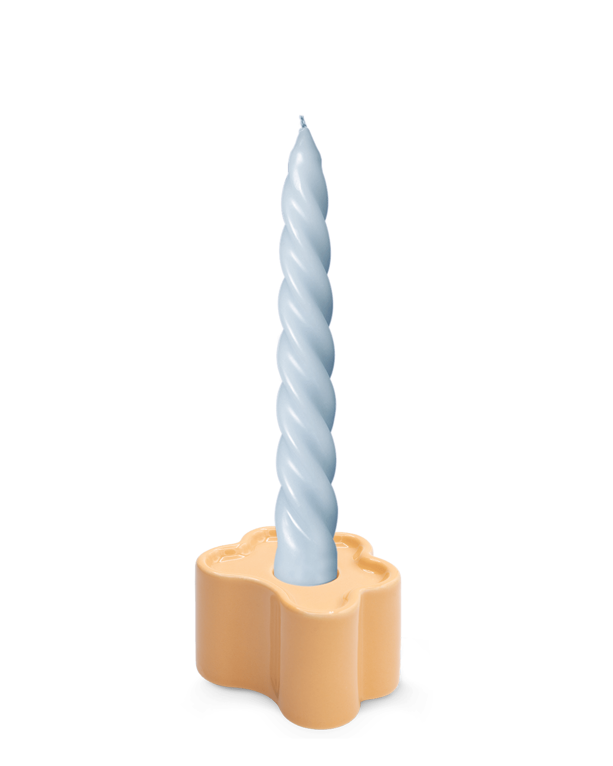 A light blue twisted candle sits in an OCTAEVO Flora Candle Holder in Orange, hand-glazed.