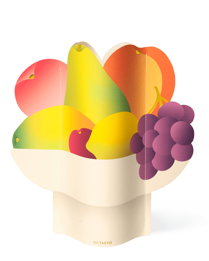 OCTAEVO Fruit Bowl Paper Vase: a white centerpiece, vibrantly adorned with grapes, pears, peaches, and lemon.