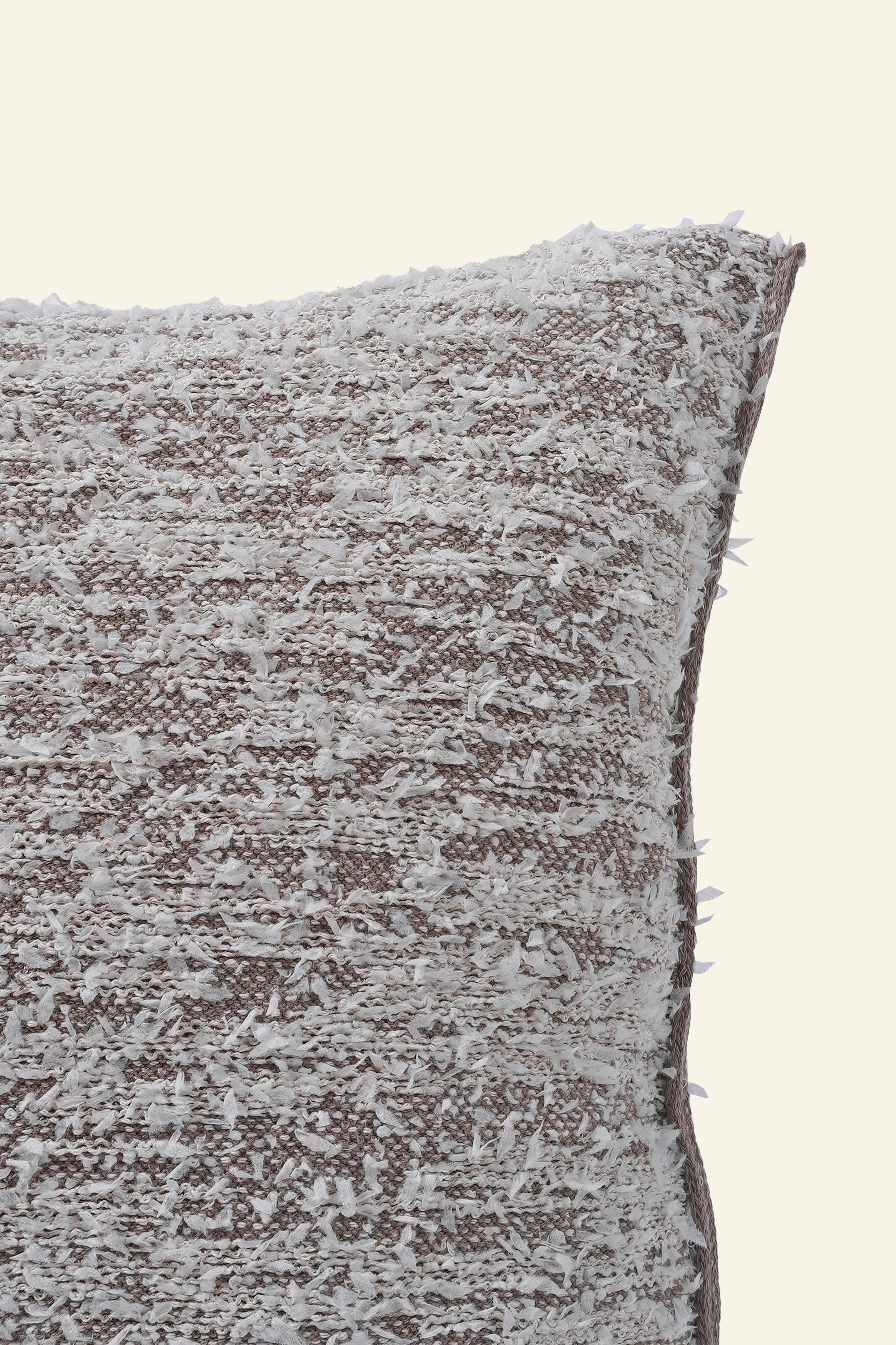 close-up of beige fuzzy knit pillowcase in organic cotton and recycled polyamide