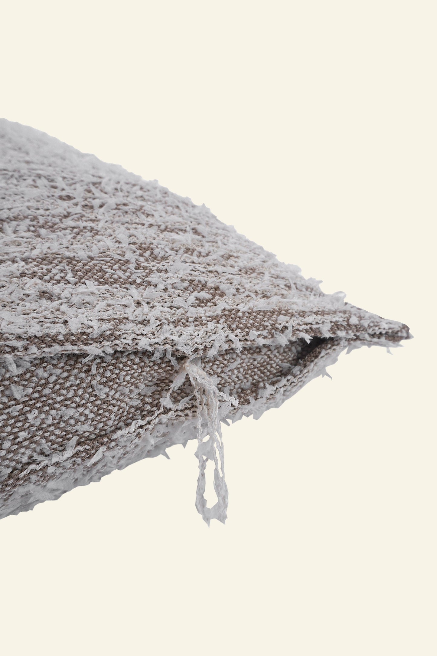 detail of beige fuzzy knit pillowcase in organic cotton and recycled polyamide