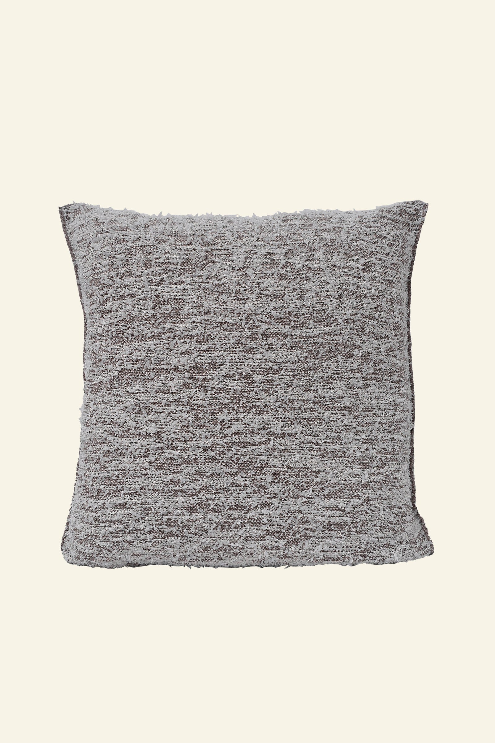 front side of beige fuzzy knit pillowcase in organic cotton and recycled polyamide on beige background