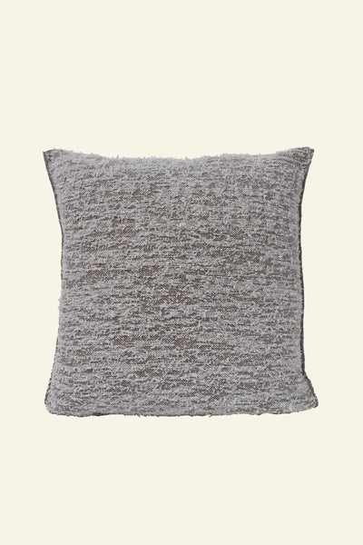 front side of beige fuzzy knit pillowcase in organic cotton and recycled polyamide on beige background