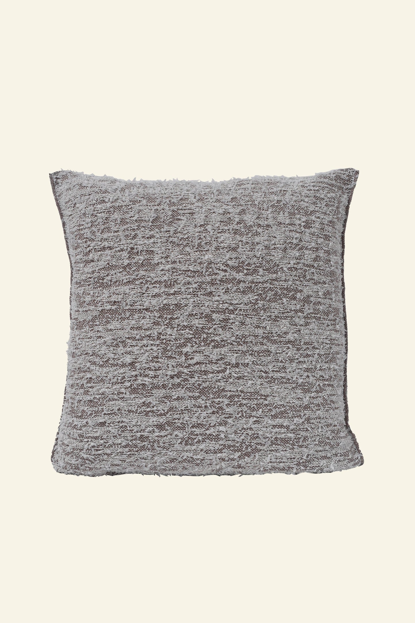 front side of beige fuzzy knit pillowcase in organic cotton and recycled polyamide on beige background