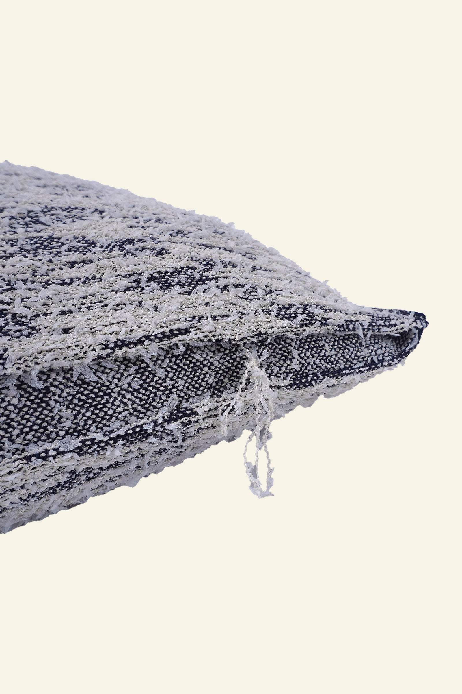 detail of navy fuzzy knit pillowcase in organic cotton and recycled polyamide