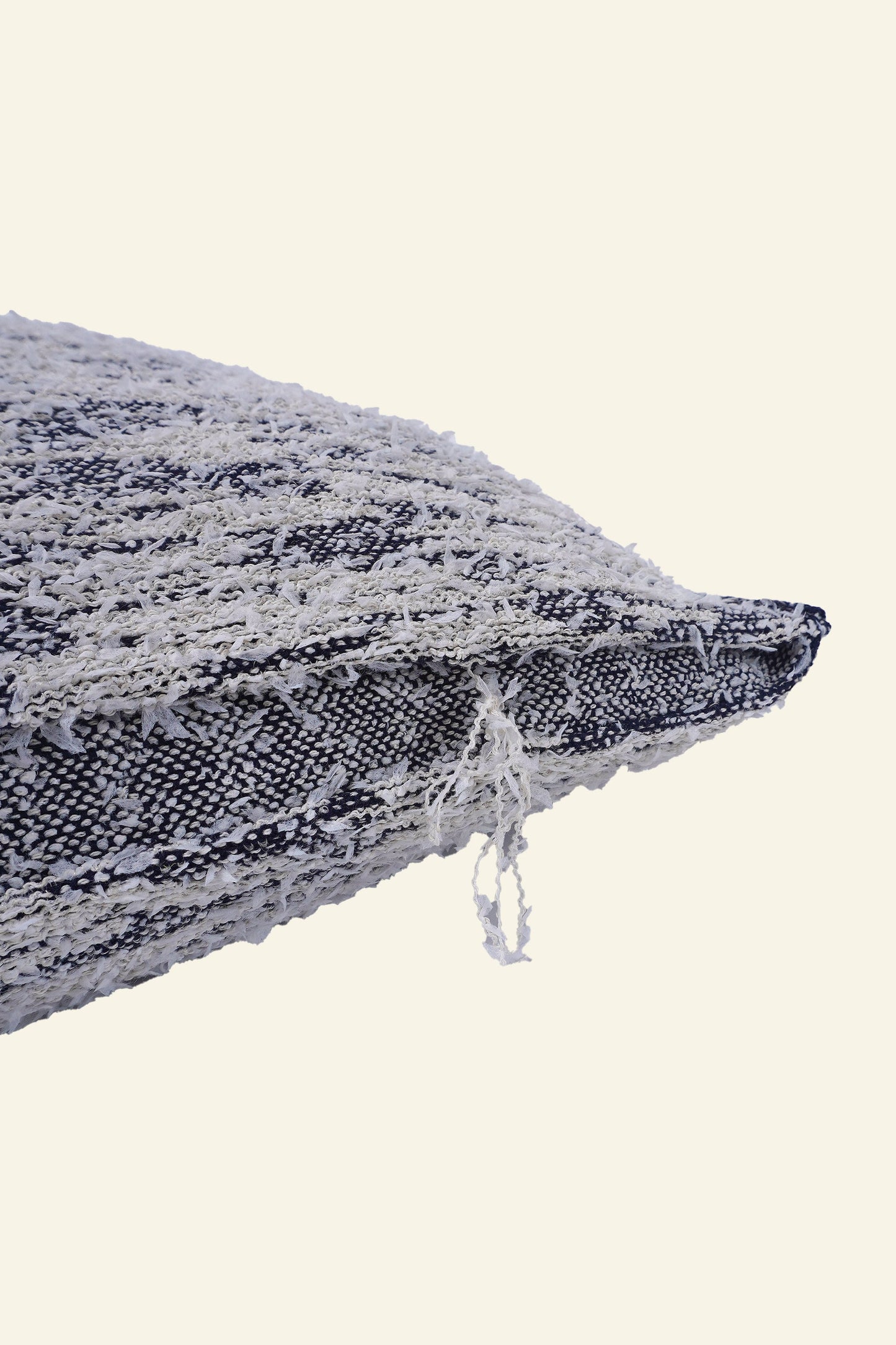 detail of navy fuzzy knit pillowcase in organic cotton and recycled polyamide