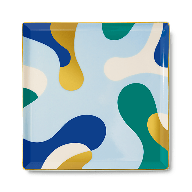 The Gaia Ceramic Tray by Octaevo is a chic square catchall with blue, green & yellow shapes and gold foil accents.