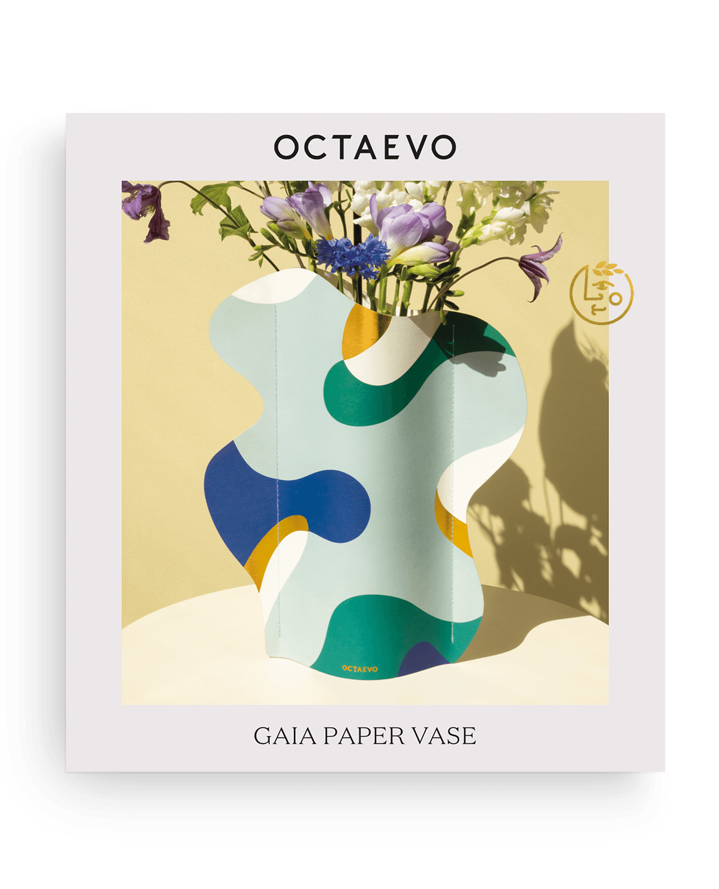 Gaia Paper Vase by Octaevo—abstract, colorful, water resistant, nature-inspired decor with flowers on yellow background.