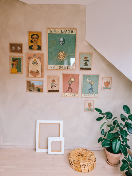 art studio with a gallery wall with artworks of the sun