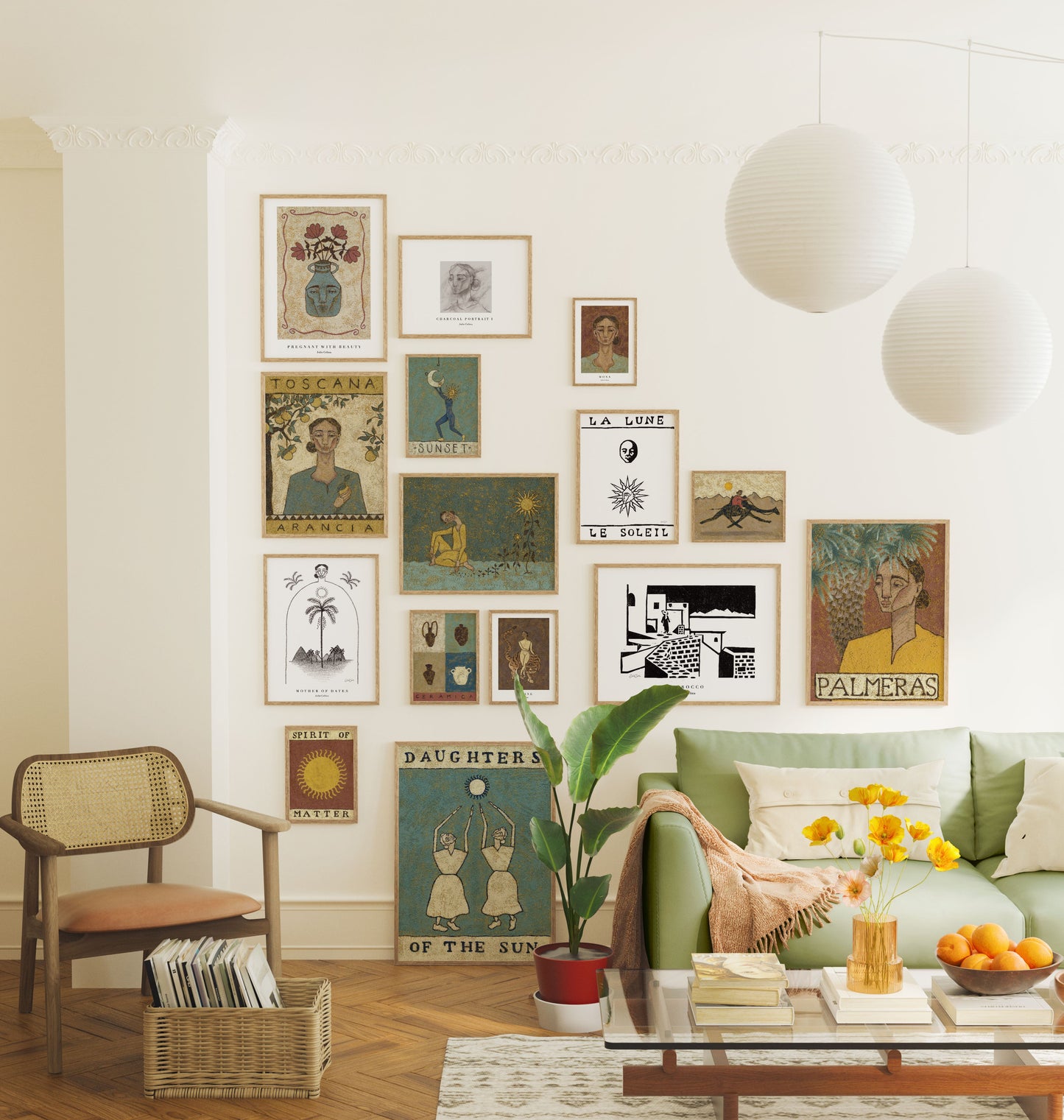 gallery wall with artworks themed around the sun and desert. green couch and flowers