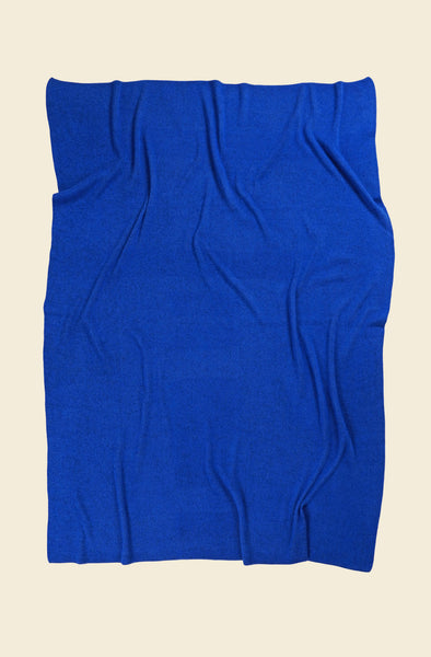 back side of blue geometric column knit blanket in merino wool and organic cotton