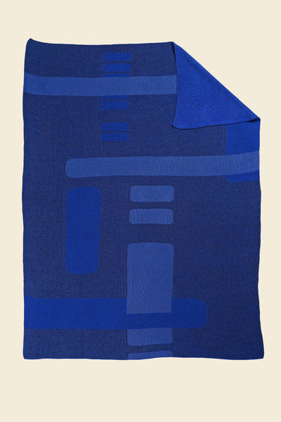 blue geometric column knit blanket with flipped corner in merino wool and organic cotton