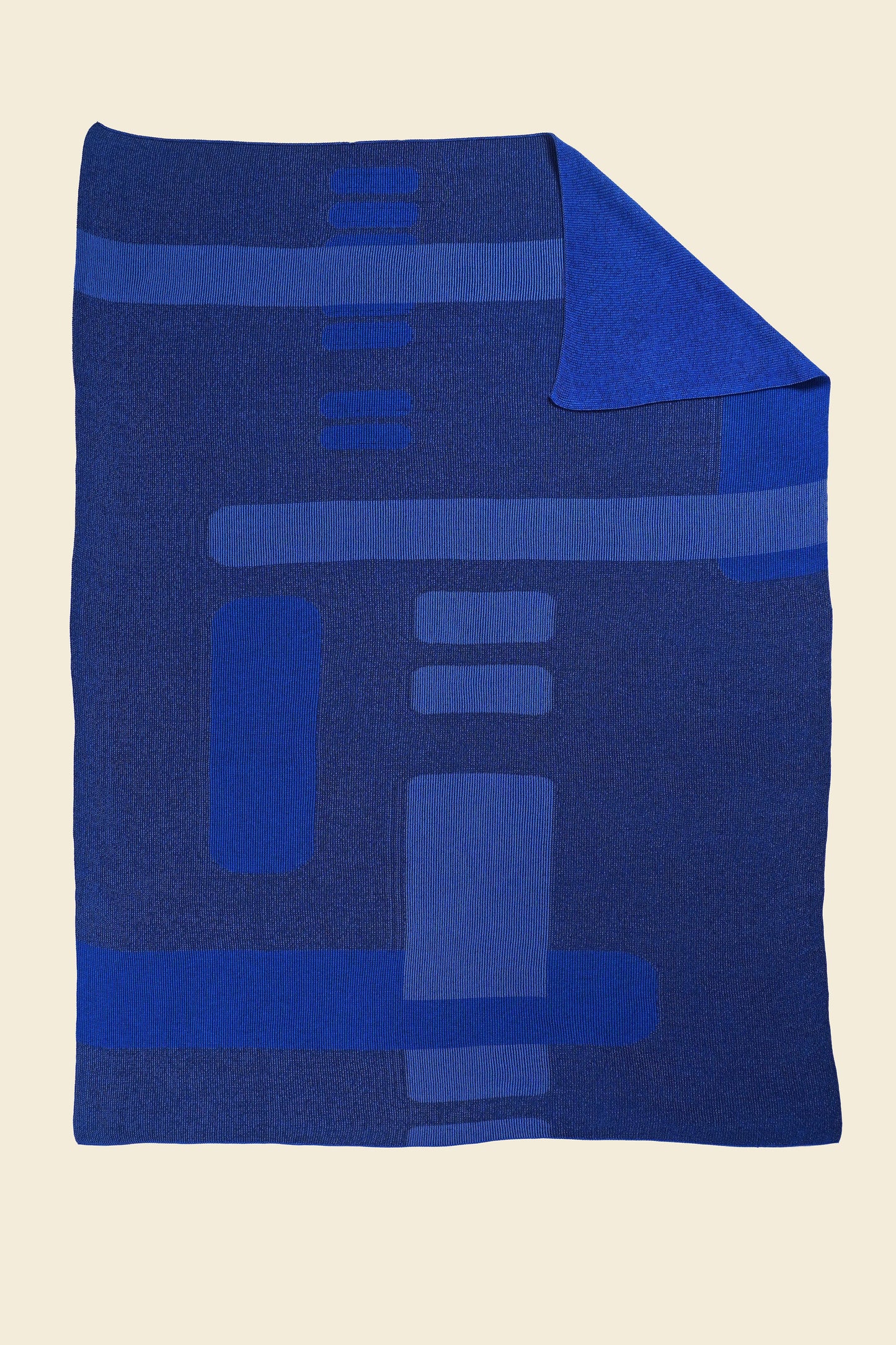 blue geometric column knit blanket with flipped corner in merino wool and organic cotton