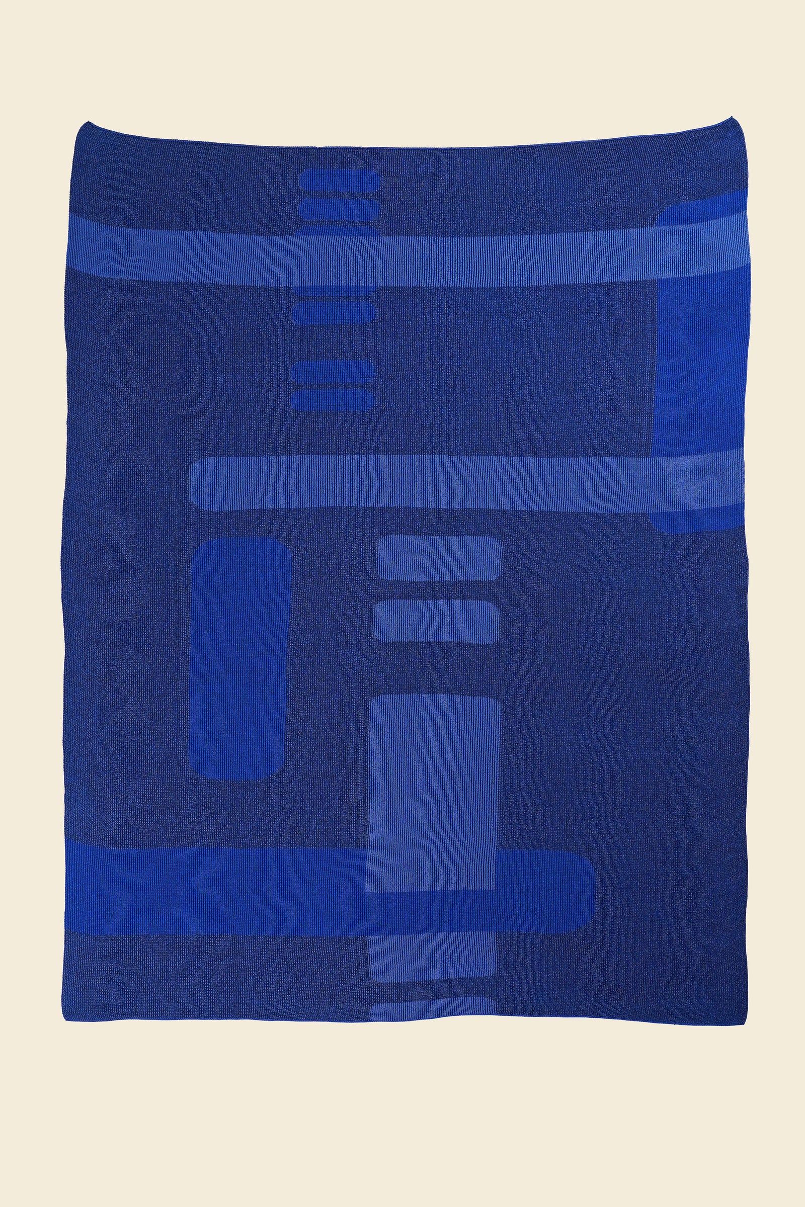 laid flat blue geometric column knit blanket in merino wool and organic cotton