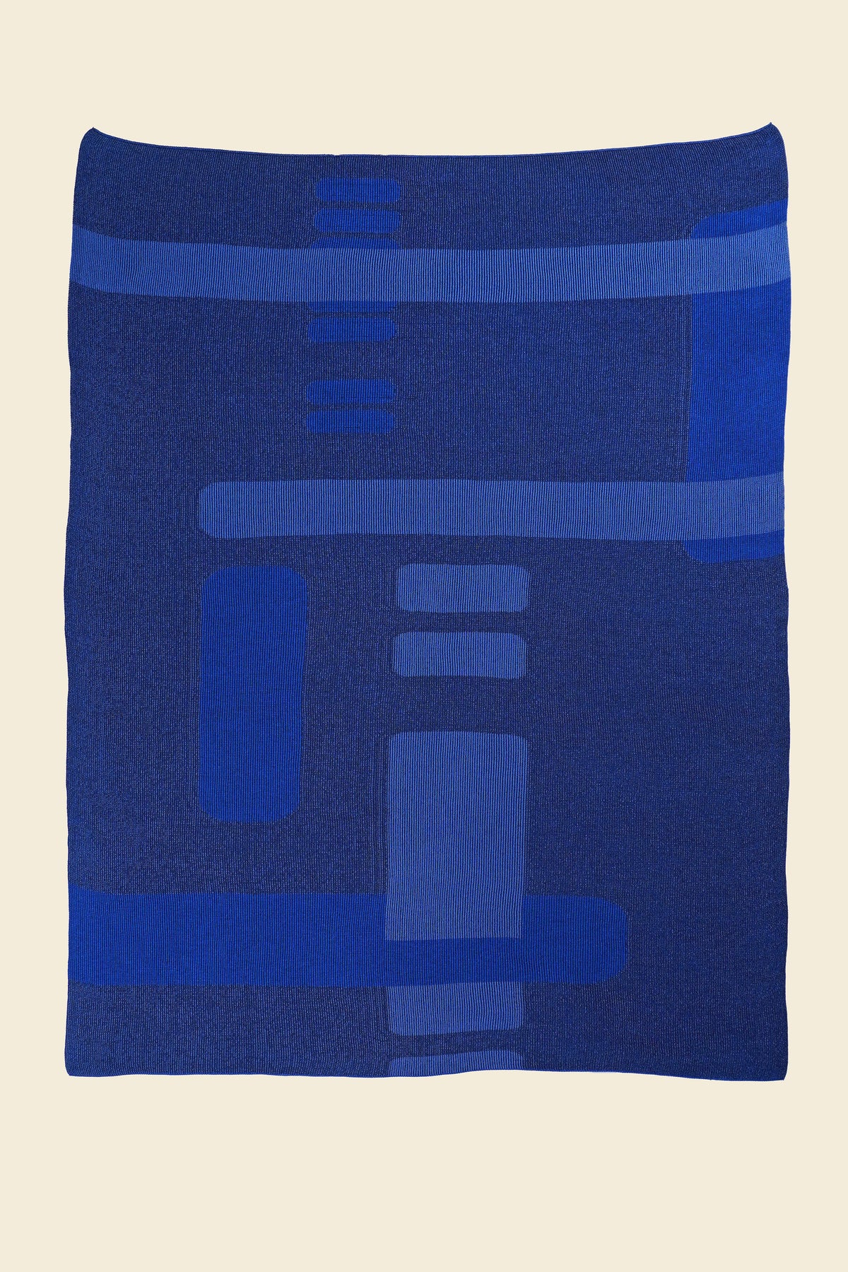 laid flat blue geometric column knit blanket in merino wool and organic cotton