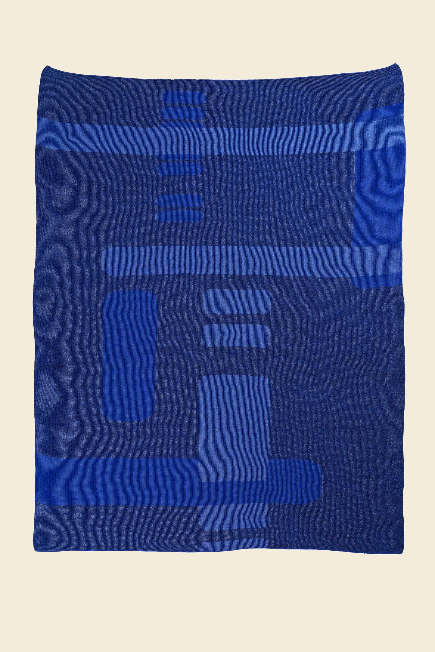 laid flat blue geometric column knit blanket in merino wool and organic cotton