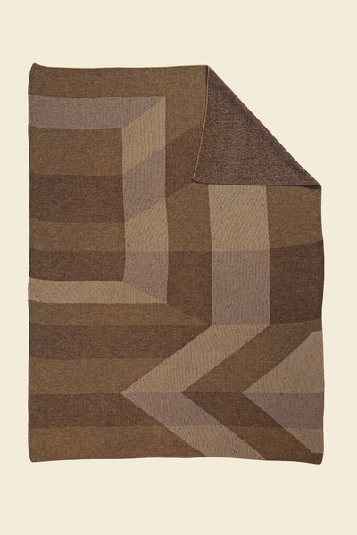 brown/gold geometric ikat knit blanket with flipped corner in merino wool and organic cotton