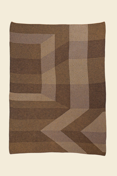 laid flat brown/gold geometric ikat knit blanket in merino wool and organic cotton