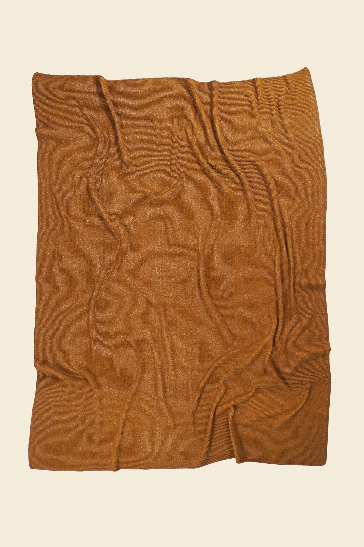 back side of ochre geometric column knit blanket in merino wool and organic cotton