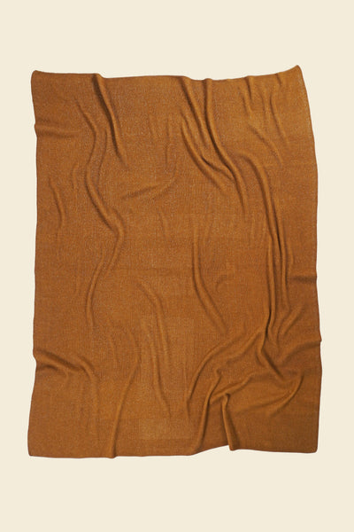 back side of ochre geometric column knit blanket in merino wool and organic cotton