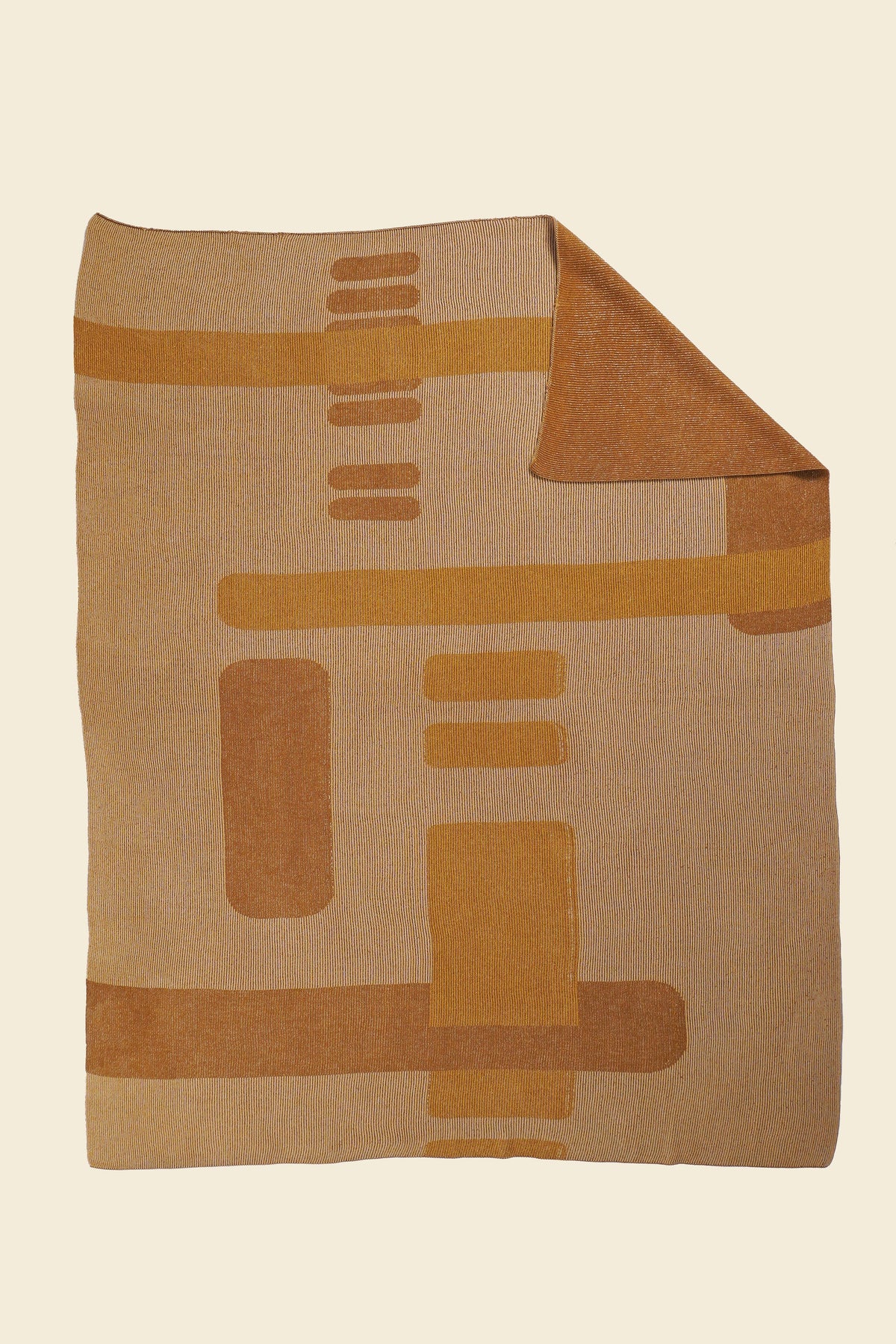 ochre geometric column knit blanket with flipped corner in merino wool and organic cotton