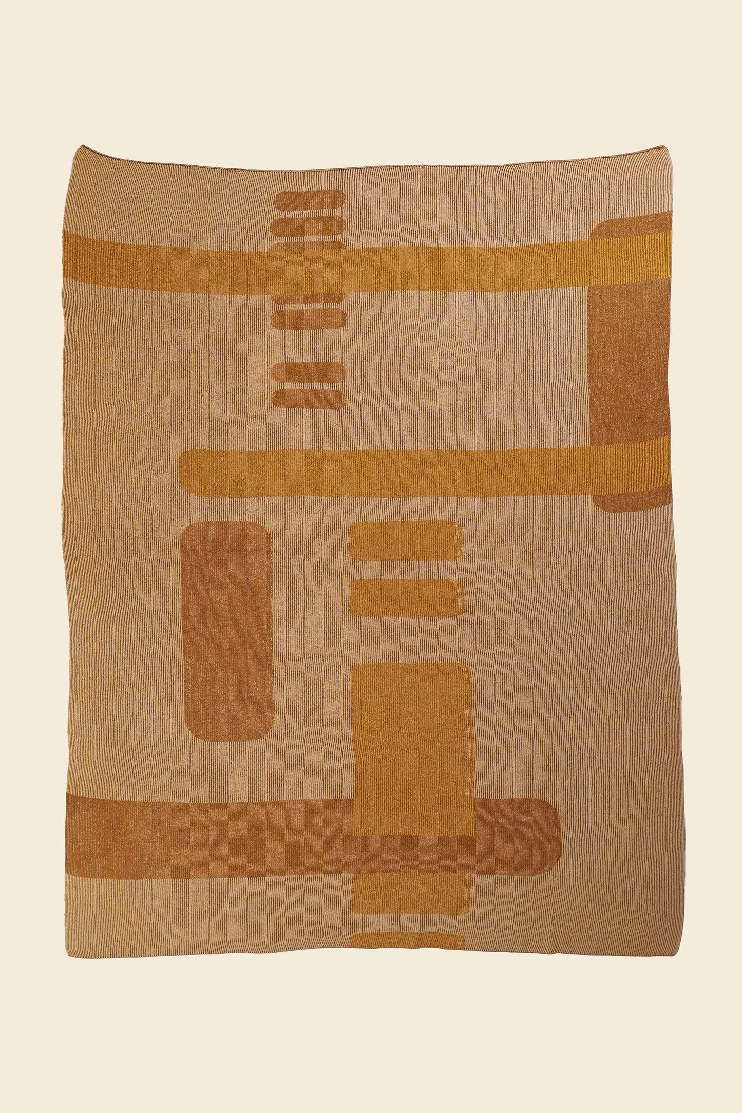 laid flat ochre geometric column knit blanket in merino wool and organic cotton