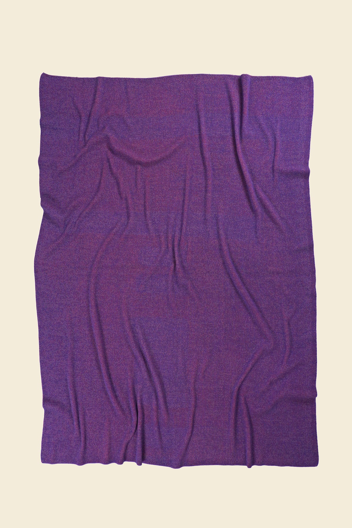 back side of pink geometric column knit blanket in merino wool and organic cotton