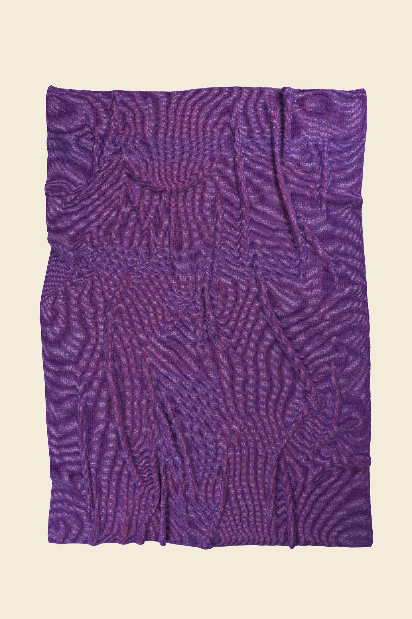 back side of pink geometric column knit blanket in merino wool and organic cotton