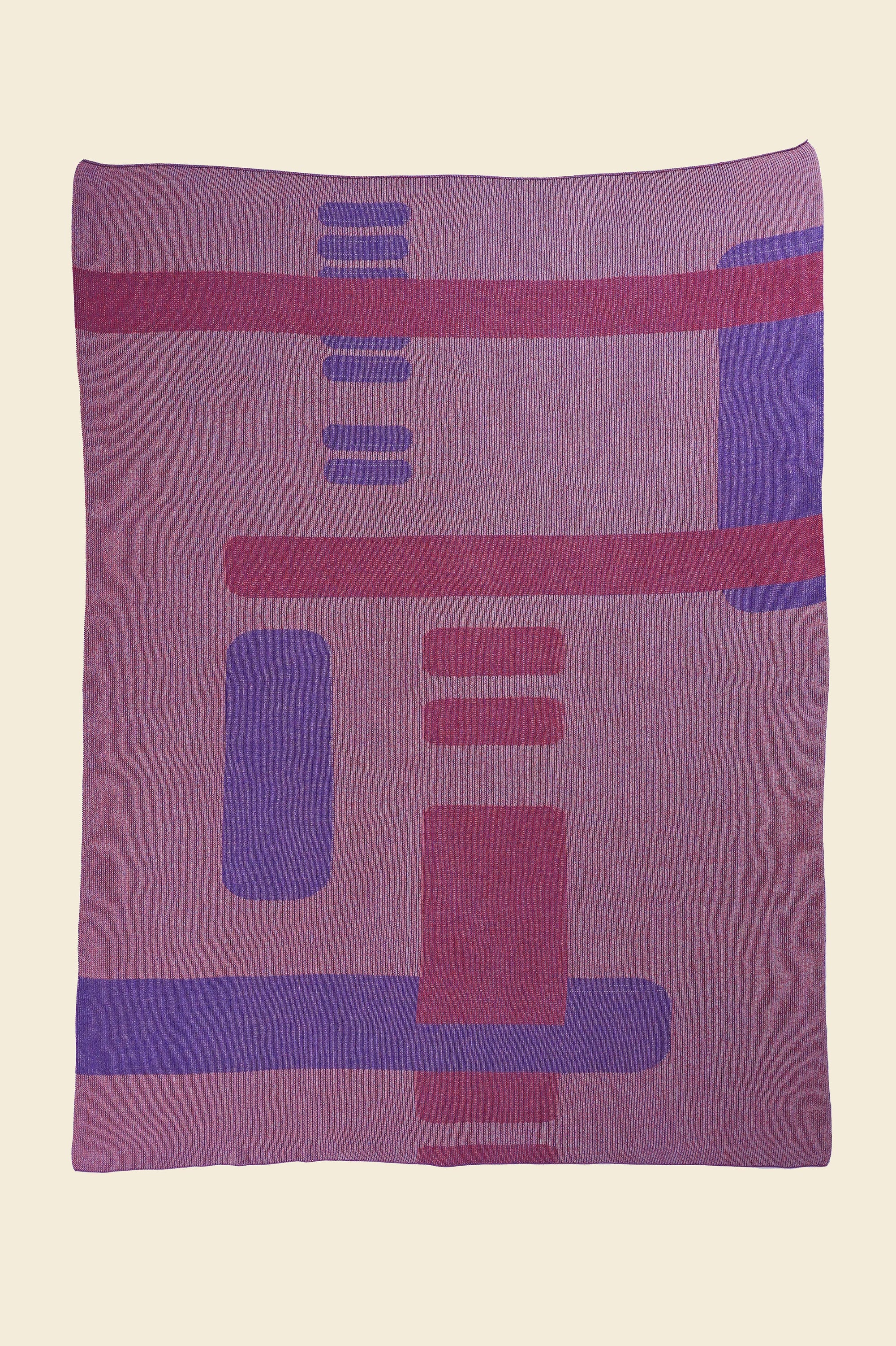 laid flat pink geometric column knit blanket in merino wool and organic cotton