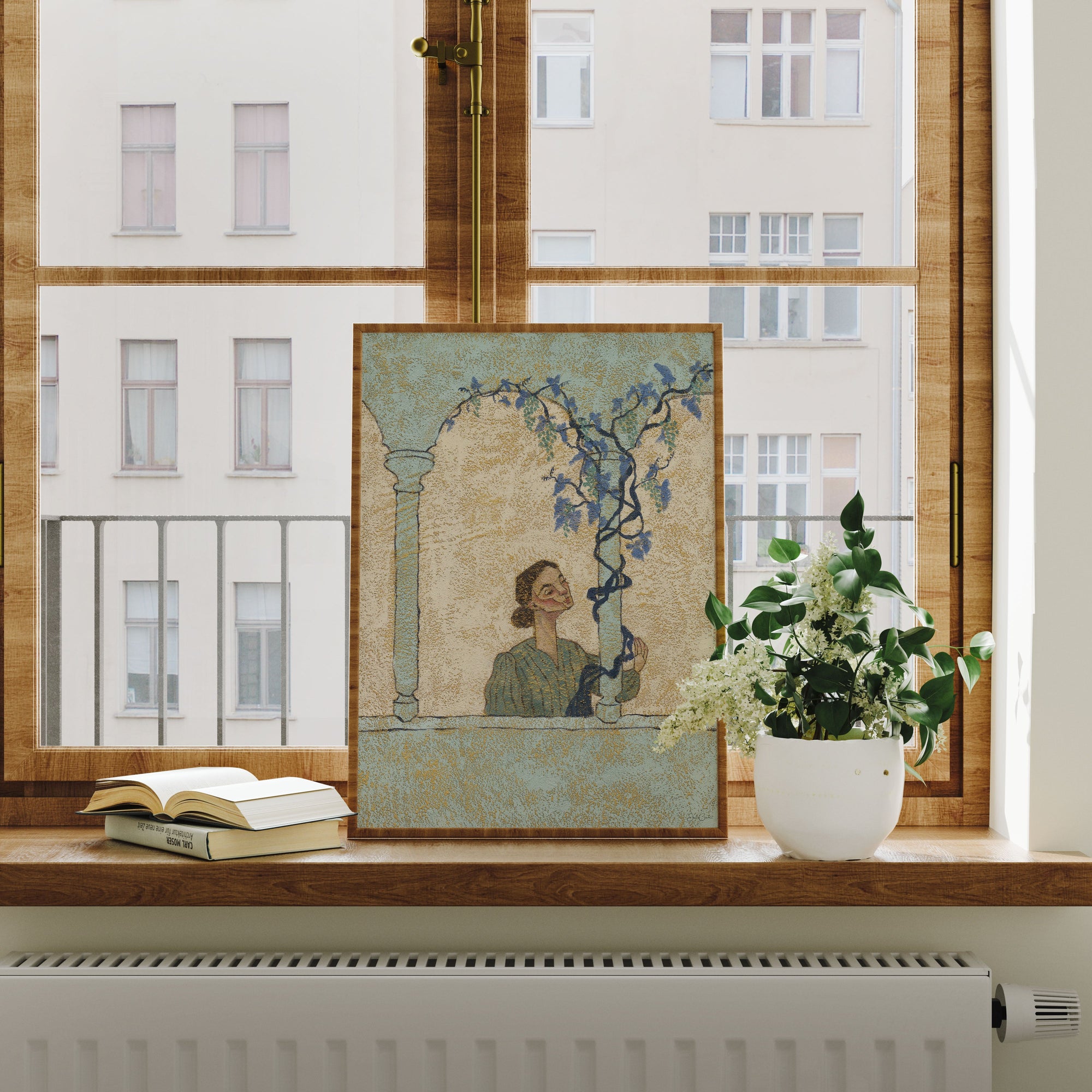 Framed artwork of a woman in Italy on a windowsill with books and a plant
