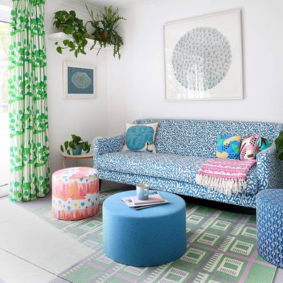 Colourful green and blue living room with the Green Labourdonnais checkered flatweave rug