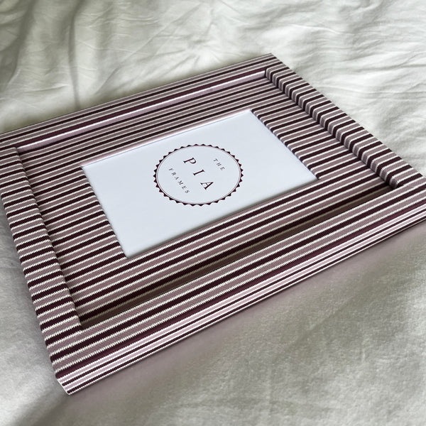 Handmade blush and burgundy zigzag picture frame angled full view on plain background