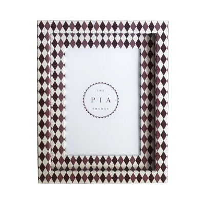 Handmade burgundy, blush and white harlequin fabric frame, on a white linen fabric