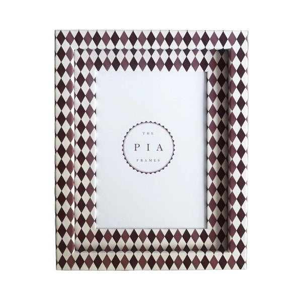 Handmade burgundy, blush and white harlequin fabric frame, on a white linen fabric